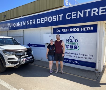 Couple outside the return and earn depot